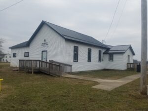 White township hall building with ramp entrance.