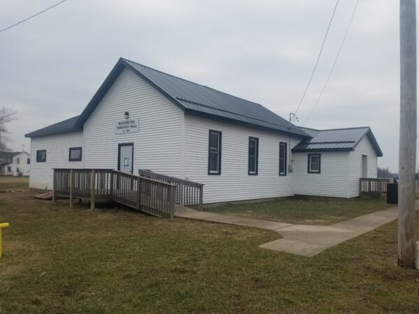 White township hall building with ramp entrance.